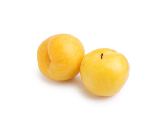 Whole ripe yellow cherry plums isolated on white