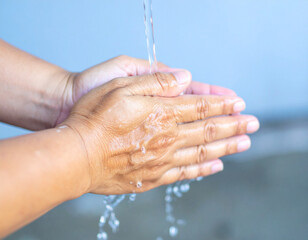 Fototapeta premium Washing Hands with Running Water for Hygiene and Health