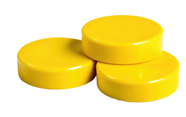 Three bright yellow, circular, plastic discs stacked
