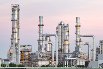 Oil gas refinery plant or petrol chemical plant at duck sky background. Heavy industry in Map Ta Phut Industrial Estate to processing, manufacturing petroleum products i.e. diesel fuel and gackground.