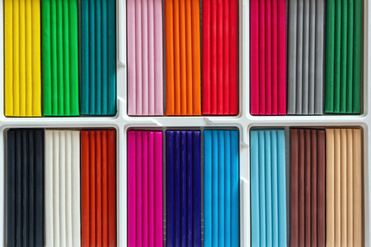 Multi-colored plasticine in a box, for artistic modeling and development of children's creativity - Powered by Adobe