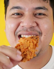 Man eating fried chicken (2)
