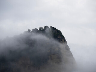 Misty Mountain Peak Emerging from Clouds