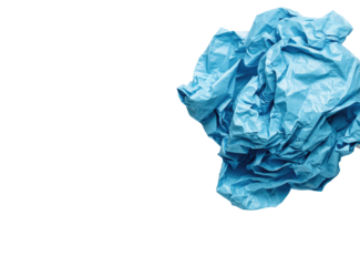 Crumpled light-blue paper ball against a black background