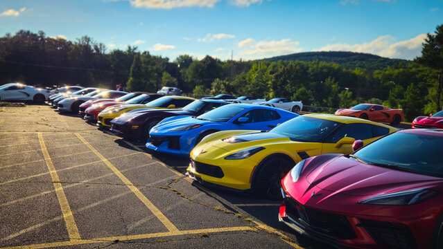 A lineup of Chevrolet Corvettes, featuring various generations and colors, parked outside (Rothschild, WI (USA) -  Aug 16, 2025). For Editorial Use Only.