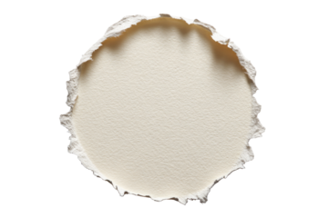 Circular hole punched through light beige paper