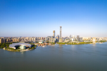Naklejka premium Modern city skyline with lake and buildings in Suzhou, China