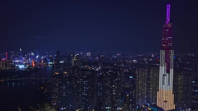 Night view landmark tallest skyscraper with illuminated of Saigon or Ho chi minh city with bridge at in Vietnam from drone.