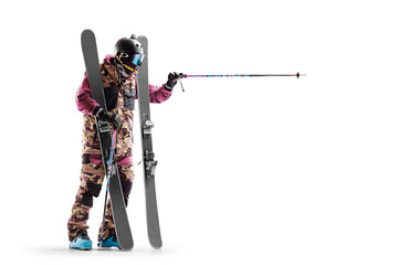 Skiing. Skier points the direction path. Winter sports. Athlete. Sport emotion. Advertising photo. Sportsman in a ski suit. Sport. Isolated