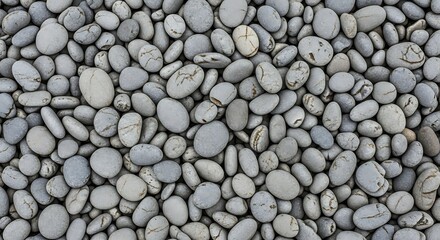 Natural grey granite wall texture featuring a seamless pattern of smooth, rounded stones