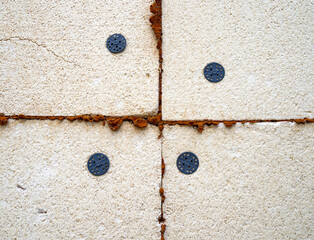 Darkened by time polystyrene foam used as insulation on the outer wall of a building