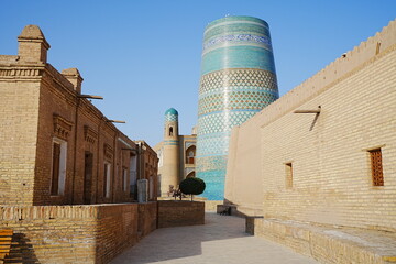 Kalta-minor Minaret and Walled Fortress known as Itchan Kala in Khiva, Uzbekistan -...