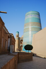 Kalta-minor Minaret and Walled Fortress known as Itchan Kala in Khiva, Uzbekistan -...