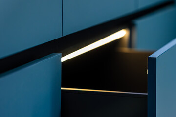 Light diagonal. Drawer close up. Minimal kitchen