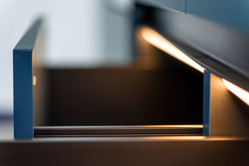 Warm edge lighting. Open section. Blue modern