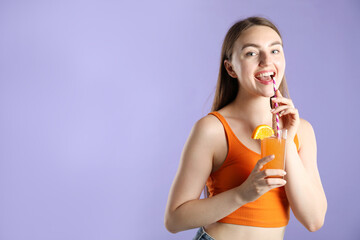 Woman with refreshing drink and straw on violet background, space for text