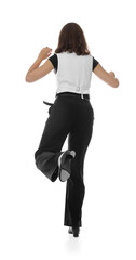 Teenage girl in tap shoes dancing on white background, back view