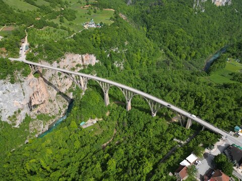 Aerial drone photo of Đurđevića Tara Bridge and Tara River canyon viewed from distance without sky Durmitor Montenegro