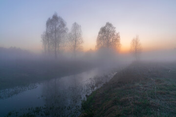 Fototapeta premium morning mist over the river at sunrise