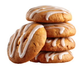 A stack of freshly baked cookies drizzled with white icing.