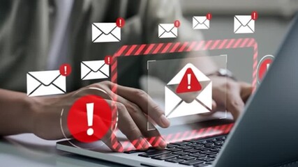 Hands on a laptop, email warnings overlay