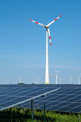 Green energy generation with wind turbines and solar panels seen in Germany