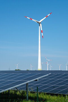 Green energy generation with wind turbines and solar panels seen in Germany