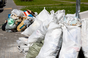 Numerous Piles of Waste Bags Have Been Collected for Proper Disposal
