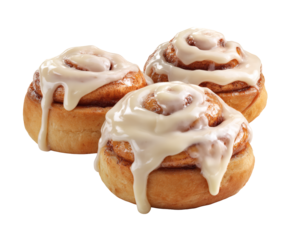 Close-up of three warm and inviting cinnamon rolls, covered in frosting.