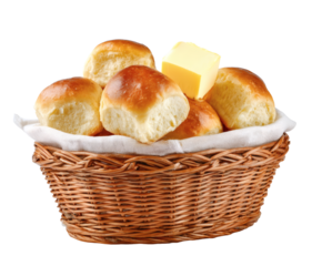 Delicious golden rolls with butter in a wicker basket, ready to serve.