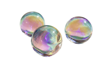 Three iridescent soap bubbles cluster against a black background