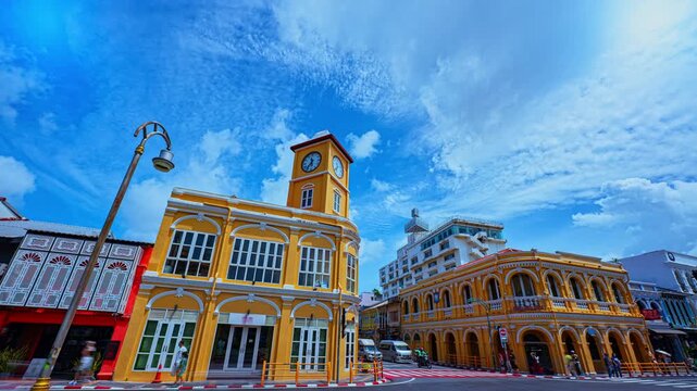 Time lapse Stunning Daytime Skies Over Classic Architecture in Phuket Old Town. where classic Sino-Portuguese buildings line the streets beneath a sky of soft white clouds and vivid blue hues.