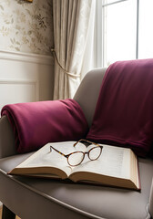 Open book with reading glasses resting on top, showing a cozy spot for reading