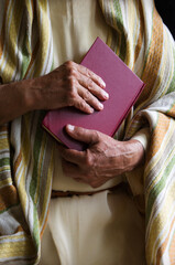 Old man holding a book
