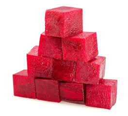 Raw red beetroot cubes arranged as pyramid isolated on white background.