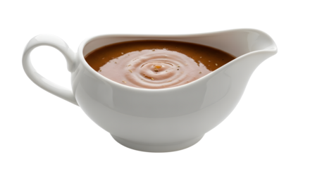 White gravy boat filled with brown gravy on transparent background
