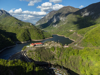 Drone captures a view of the Cernei Mountains from Băile Herculane, Romania. The landscape...