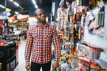 African american man standing in hardware store