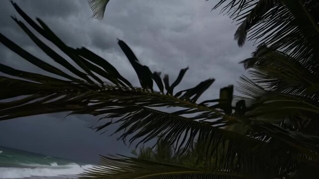 An impending hurricane approaches a deserted beach with large waves dark storm clouds these empty beach chairs are a symbol of warning and imminent danger