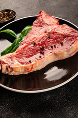 Raw steak T-bone fresh meat premium beef snack fresh delicious gourmet food background on the table rustic food top view copy space