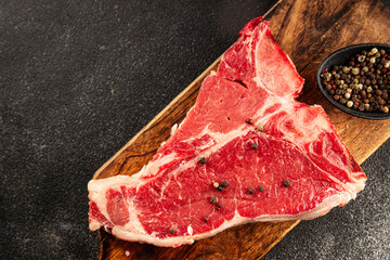 Raw steak T-bone fresh meat premium beef snack fresh delicious gourmet food background on the table...