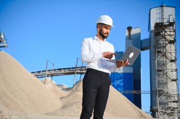 Engineer at the Crushed stone production plant. Gravel