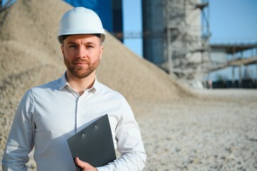 Engineer at the Crushed stone production plant. Gravel