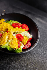 Corn salad tomato fresh vegetables snack fresh delicious gourmet food background on the table  rustic food top view copy space keto and paleo diet vegetarian and vegan food