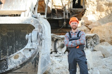 Male worker with bulldozer in sand quarry