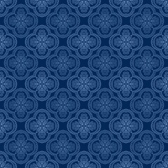 Seamless geometric pattern with ornate floral mandala design in light blue on a dark blue background. Perfect for textile design, wallpaper, wrapping paper, digital backgrounds, surface decoration