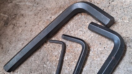 Set of Allen Wrenches on Concrete Surface
