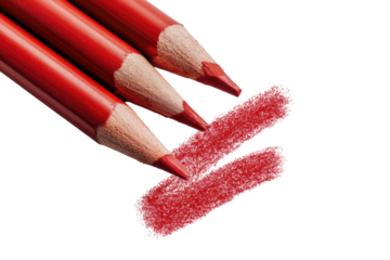 Close-up of three red colored pencils, with a smudged mark of the same color beneath them