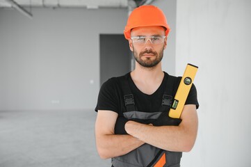 Construction Worker in uniform with spirit level