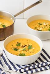 Bowls of corn chowder on kitchen counter.